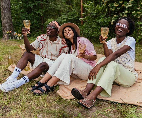 Diverse group of people smiling and looking relaxed and happy.